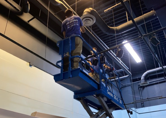 Cleaning-Supply-Vents-On-A-Scissor-Lift